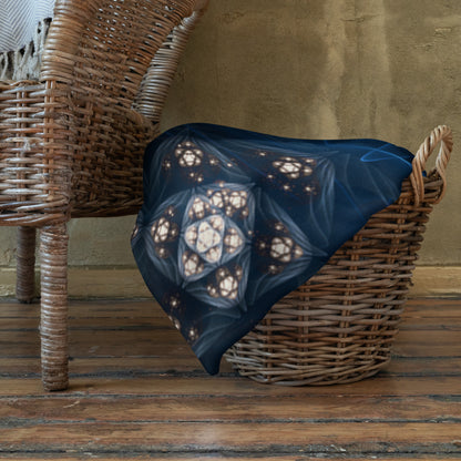 "Inner Sanctum" throw blanket folded at the foot of a bed, showing the soft texture.