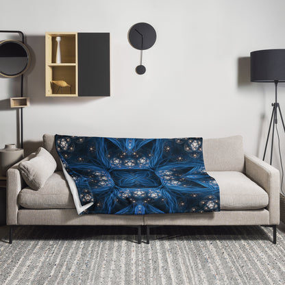 "Inner Sanctum" fractal mandala throw blanket draped over a couch in a living room.