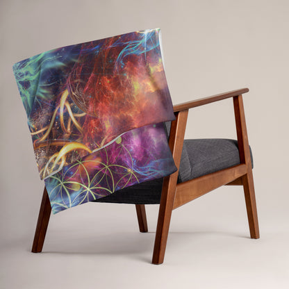 "Genesis" lion visionary art throw blanket draped over a couch in a living room.