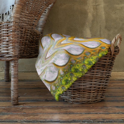 The "Activation Initiated" throw blanket draped over a couch, corner folded to show the white reverse side