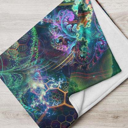 Tree of Life throw blanket draped over a chair in a plant-filled reading nook.