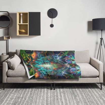 Tree of Life throw blanket draped over a sofa arm in a cozy living room setting.