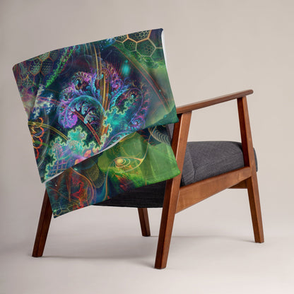 The To Bee or Not to Bee throw blanket draped over a sofa arm in a modern living room.