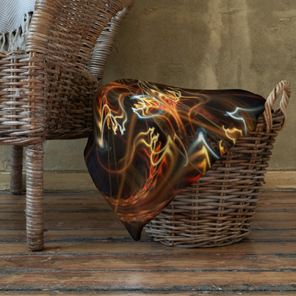 The Sigil of Valor mandala throw blanket shown draped over furniture at home.