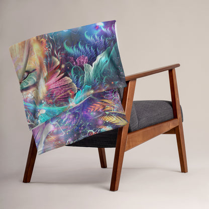The Medicina ayahuasca throw blanket shown draped over furniture at home.