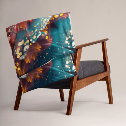 The Reaching for Light floral mandala throw blanket shown draped over furniture at home.