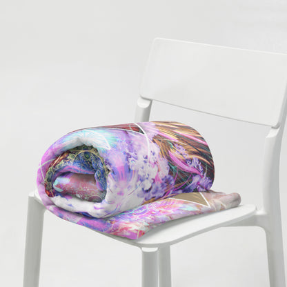 "Primordial Soup" throw blanket styled across a bed, showing size and drape.