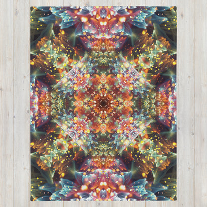 Front view of the folded Kaleidobloom fractal mandala throw blanket showing the full print.