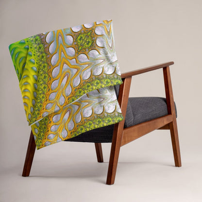 The "Activation Initiated" throw blanket draped over a couch, corner folded to show the white reverse side