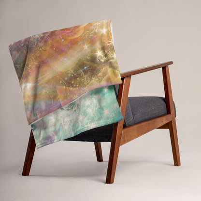 The "Celestial Vibrations" throw blanket styled on a couch in a living room